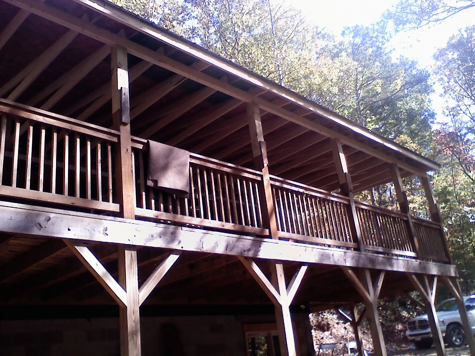 Timber framing under a new elevated porch and deck — Roof Leak Repair in New Richmond by Roofing Brothers